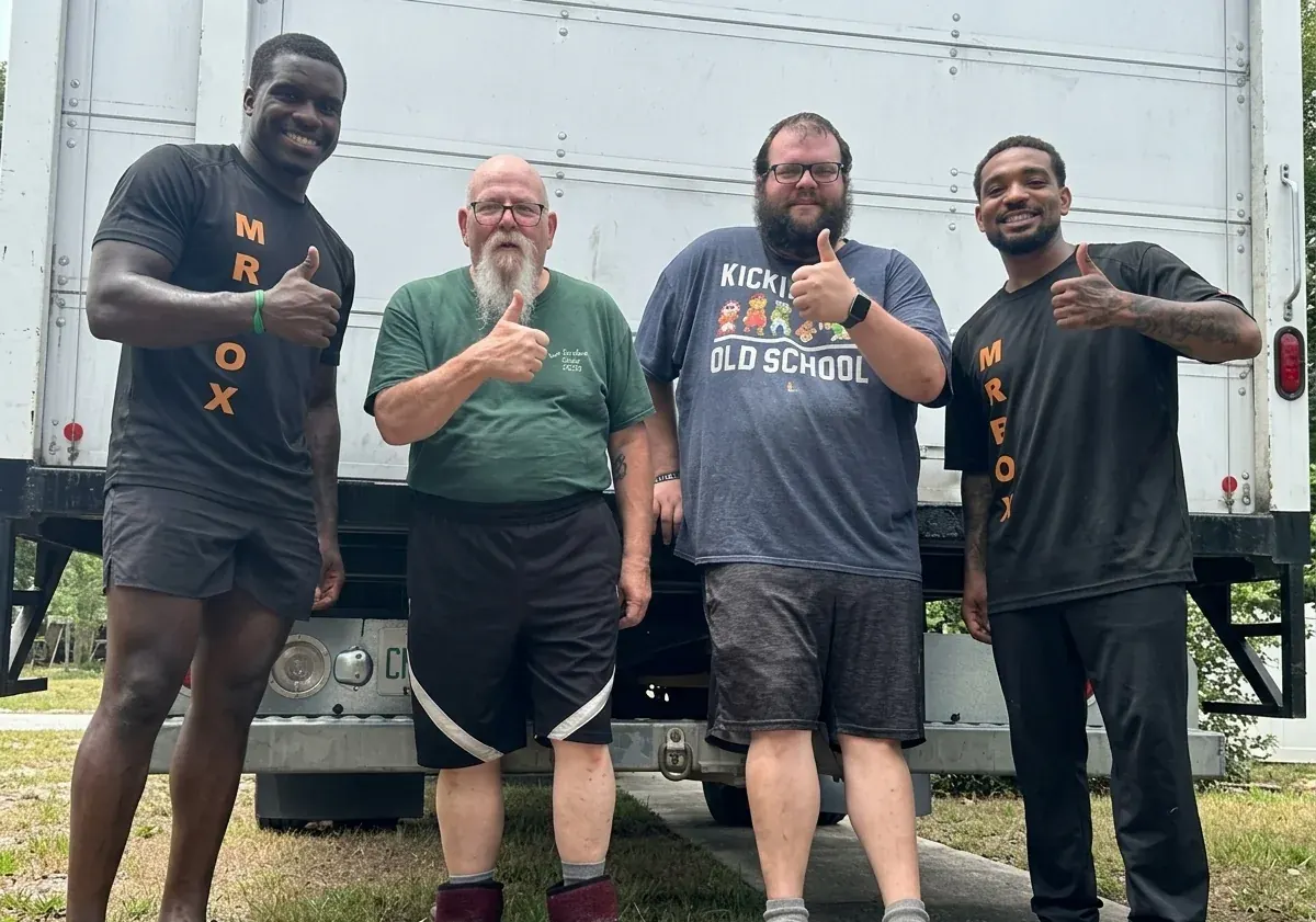 Customers and the Mr. Box crew together after a move